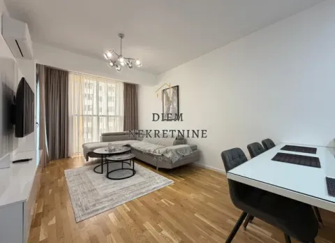 Living room with sofa, TV and dining table. - image 10