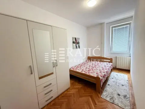 Furnished bedroom with a large wardrobe and a double bed. - image 5
