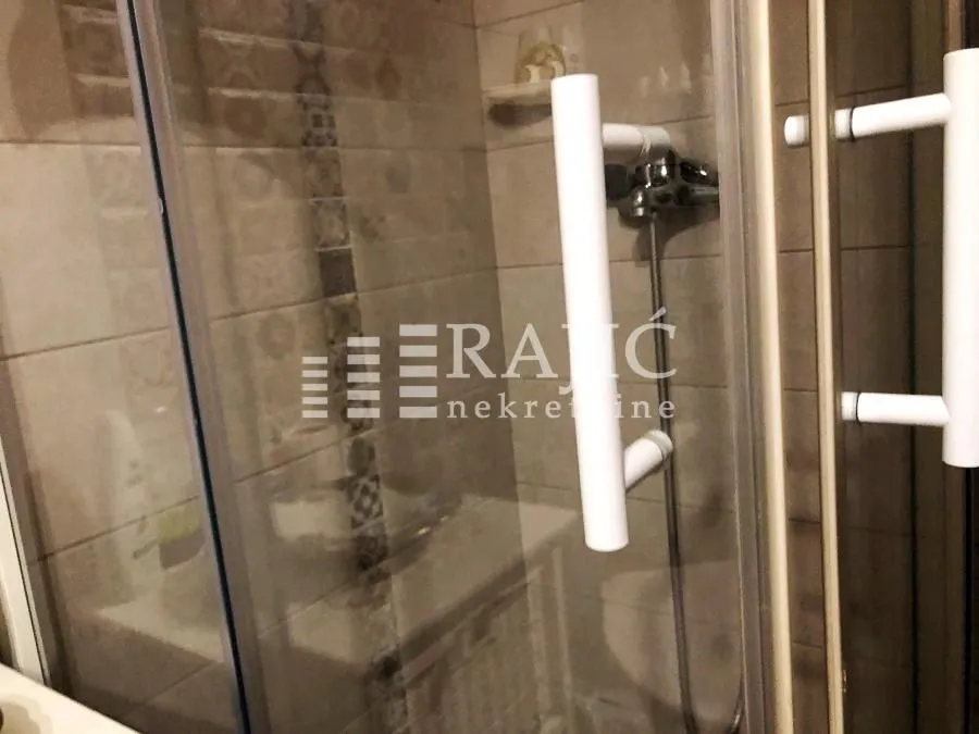 View of the shower cabin in the bathroom.