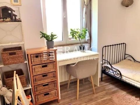 Children's bedroom with a bed, desk, and shelving units. - image 15