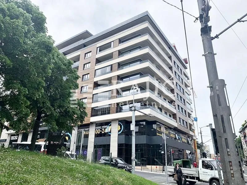 Exterior view of a modern apartment building with balconies.