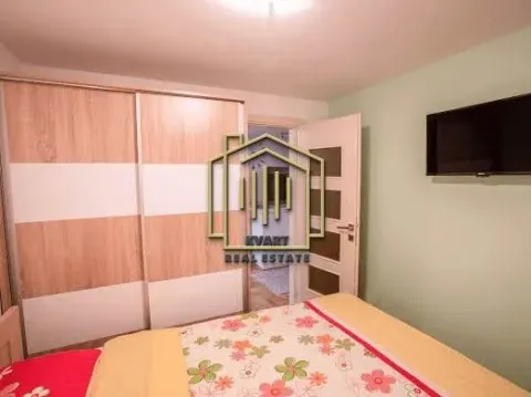 Furnished bedroom with a large wardrobe and a double bed. - image 6