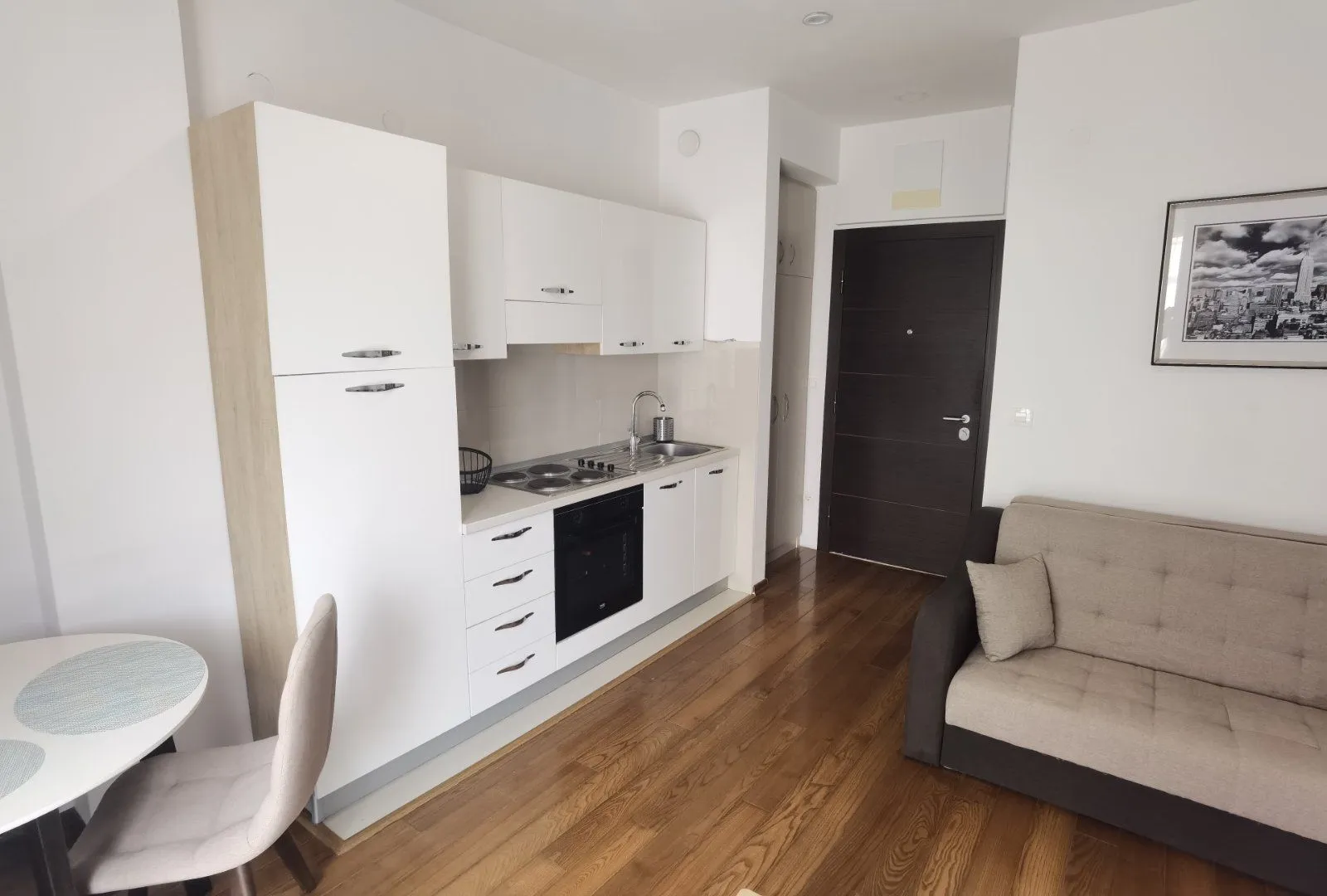 Living room with kitchen and dining area.