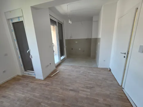 Empty kitchen space in a new construction with hardwood flooring. - image 5