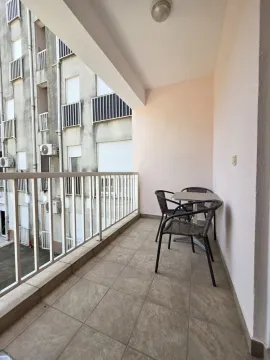 Covered balcony with seating set. - image 7