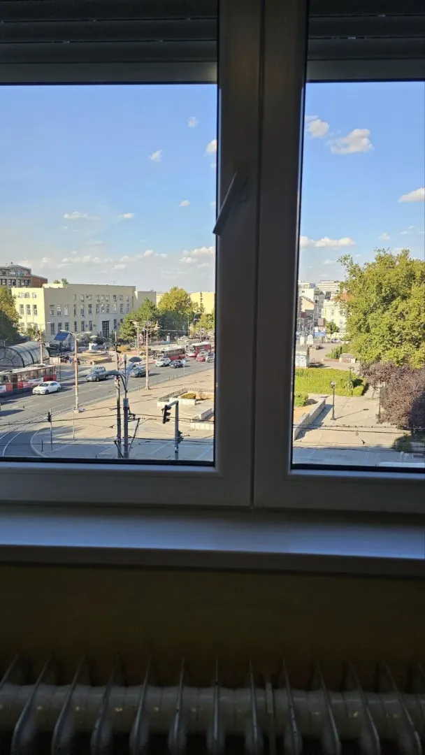 View through the window of the city street and square.