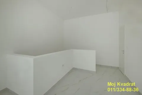 Empty room with white walls and ceramic tile flooring. - image 6