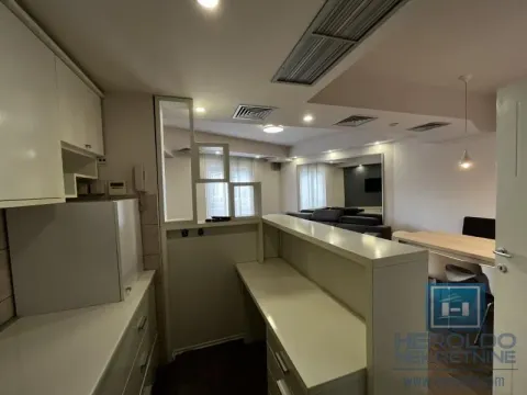 View from the kitchen towards the dining area and living room in the apartment. - image 7