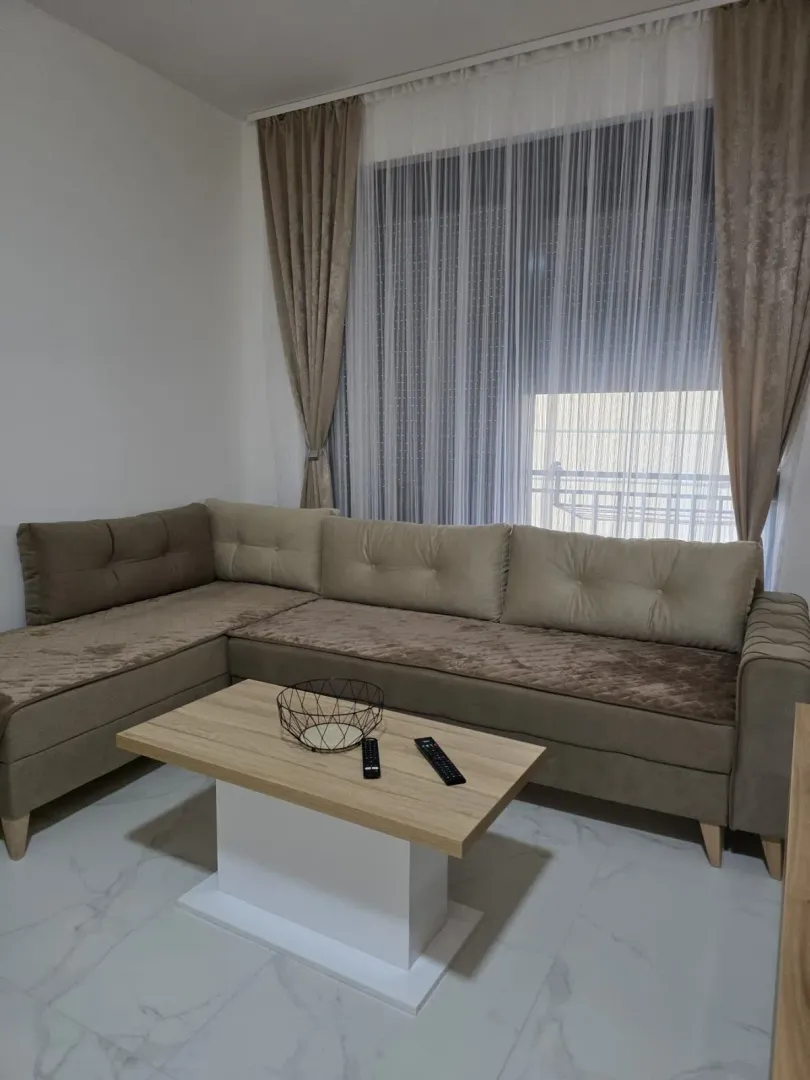 Living room with a sectional sofa and a coffee table.