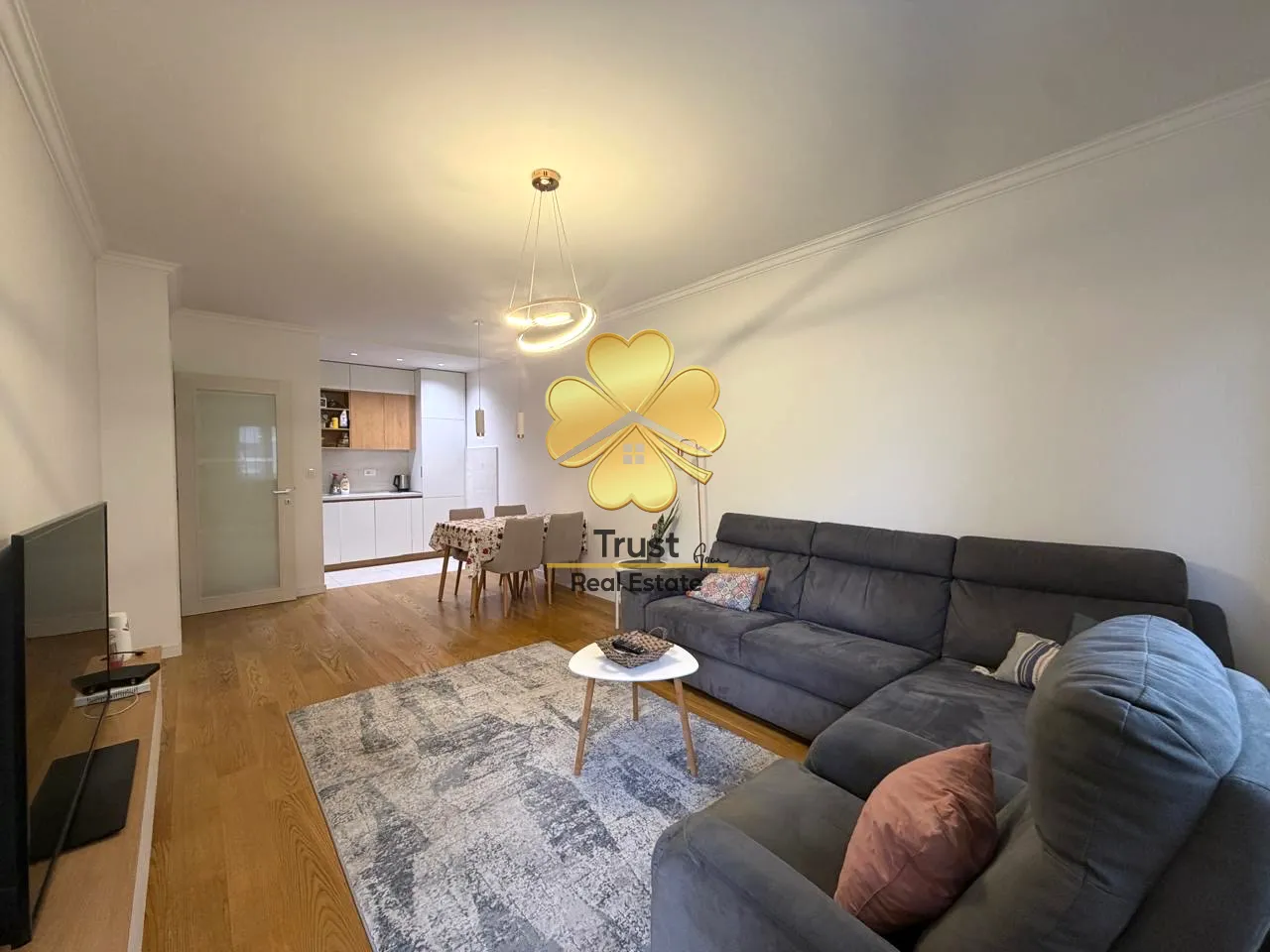 Spacious living room connected to the dining area and kitchen.