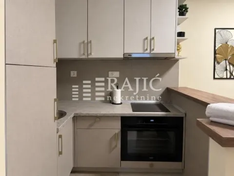 Modern kitchen with built-in appliances and cabinetry. - image 5