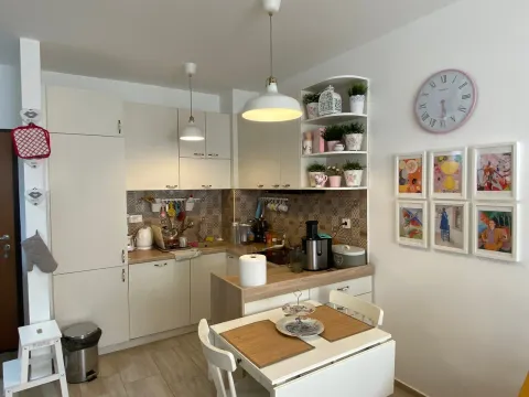Kitchen with a dining table and fitted units. - image 3