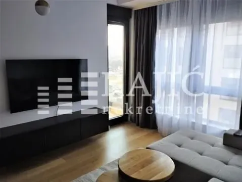 Living room with sofa and television. - image 4