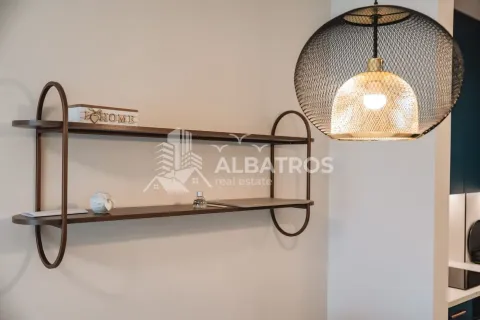 Interior detail showing a wall shelf and a modern pendant lamp. - image 10