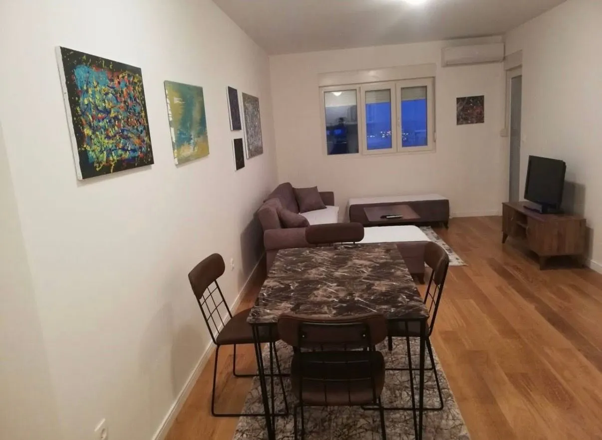Living room with a dining area and seating set.