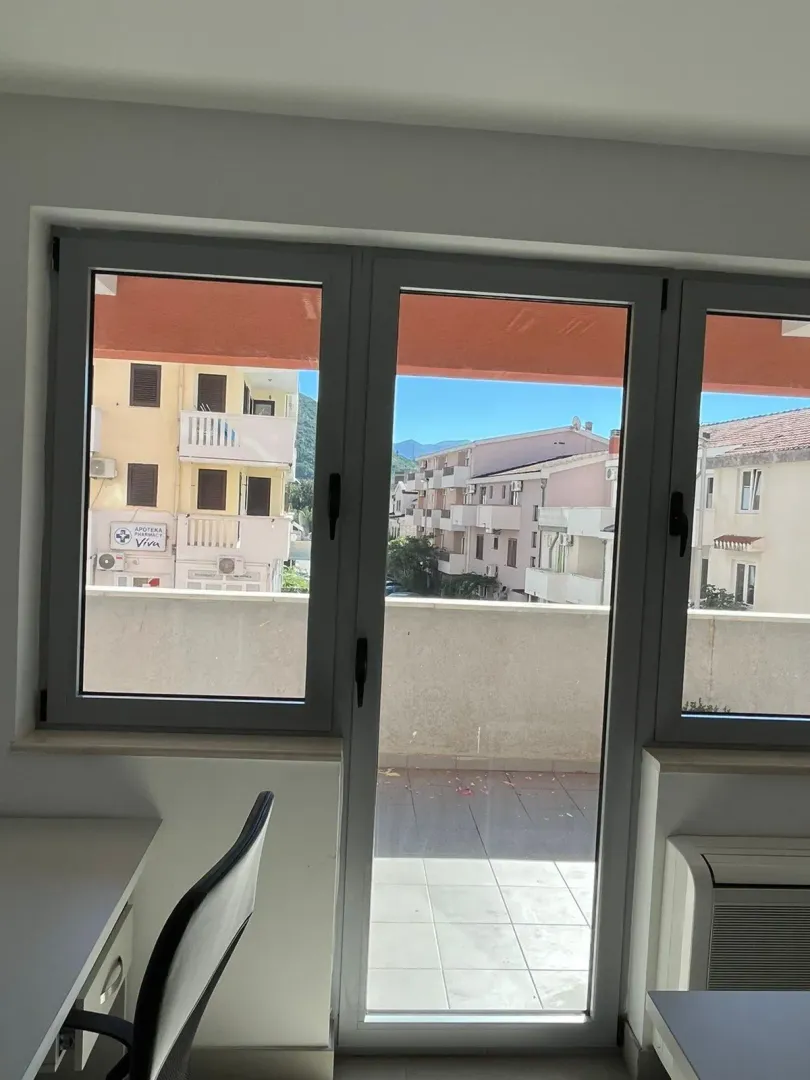 View through the window of surrounding buildings and neighborhood.