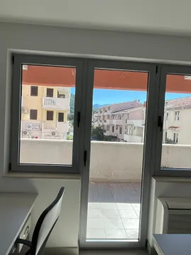 View through the window of surrounding buildings and neighborhood. - image 3