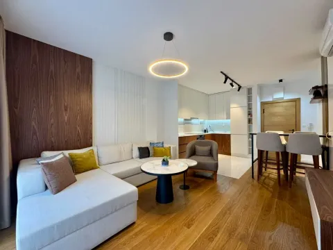 Modern living room with a sofa and dining area in the background. - image 5
