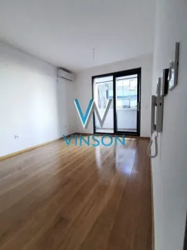 Empty room with hardwood flooring and access to a balcony. - image 4