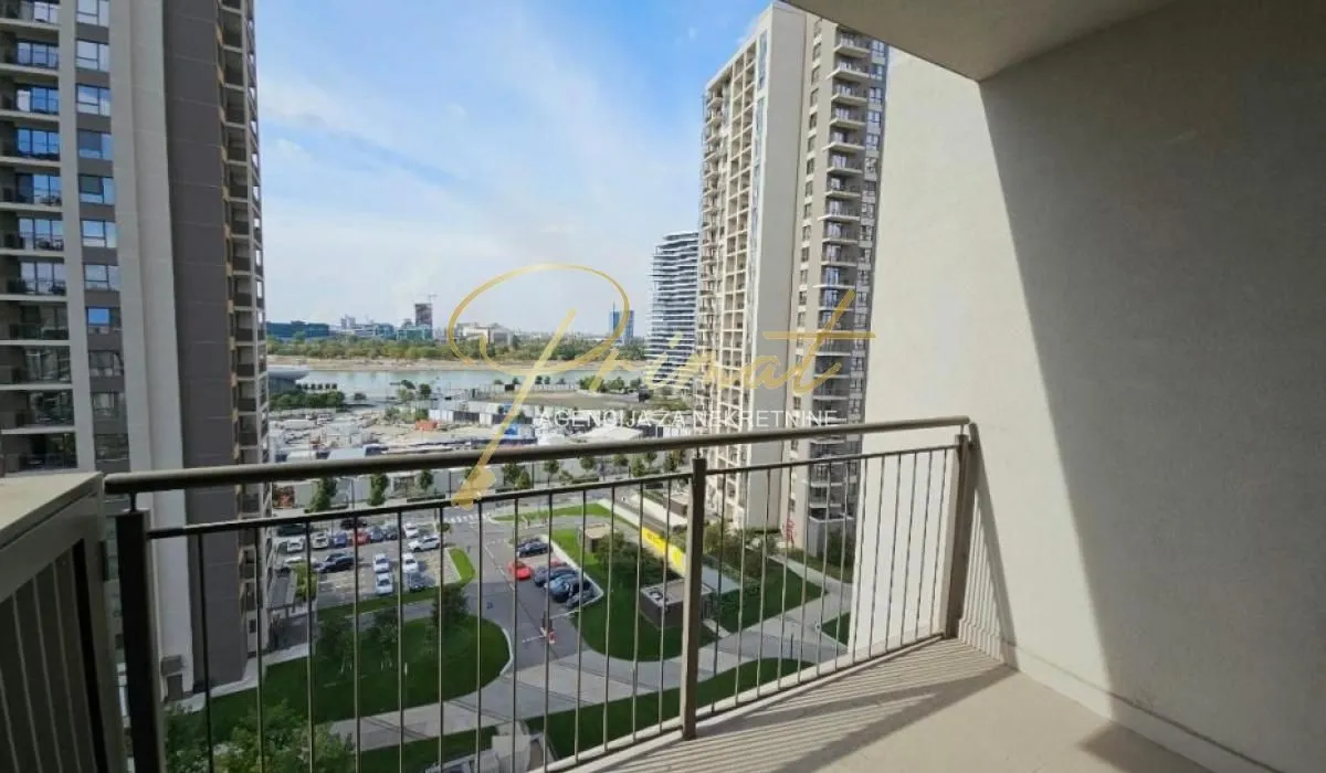 View from the balcony overlooking city buildings and surroundings.