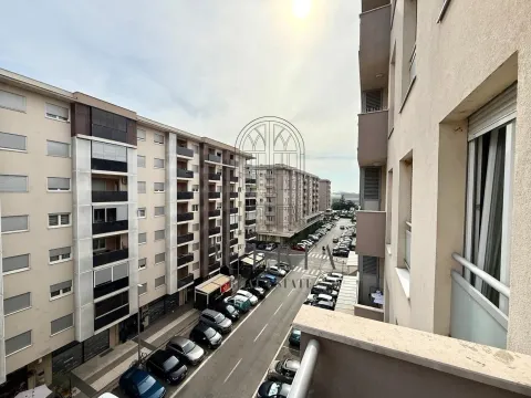 View from the terrace of the city street and surrounding buildings. - image 8