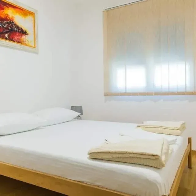 Bright bedroom with a double bed.