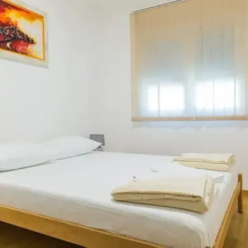 Bright bedroom with a double bed. - image 9
