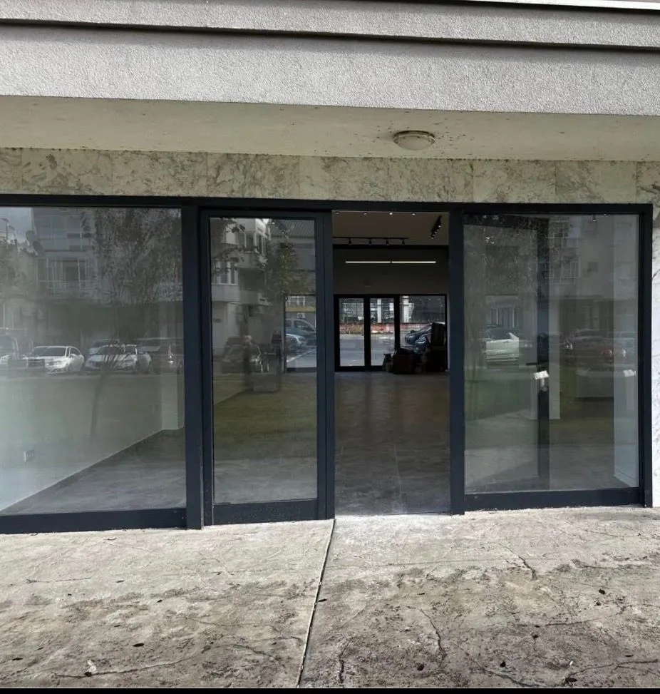 Entrance to a commercial space with a glass storefront.