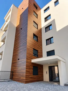 Modern entrance and facade of a residential building. - image 2