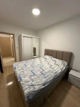 Bright bedroom with a wardrobe. - image 11