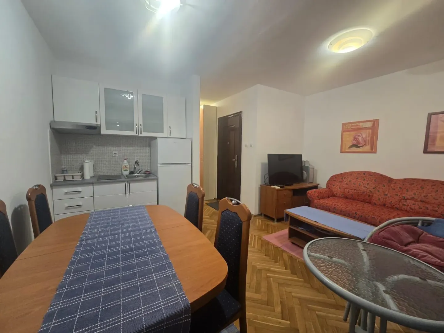 Living room with dining area and kitchen.