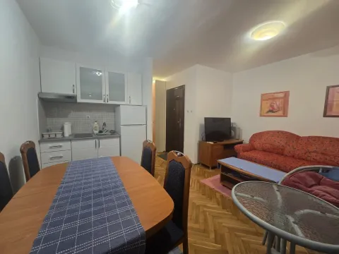Living room with dining area and kitchen. - image 4