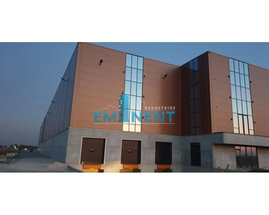 Exterior view of a modern commercial and warehouse facility with loading docks.