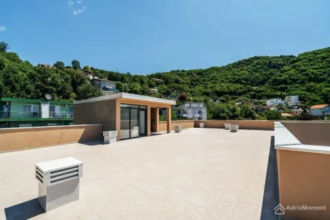 Large spacious rooftop terrace overlooking the surrounding greenery and hills. - image 3
