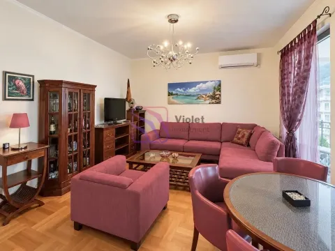 Living room with a sofa set, armchair, dining table, and wooden furniture. - image 3