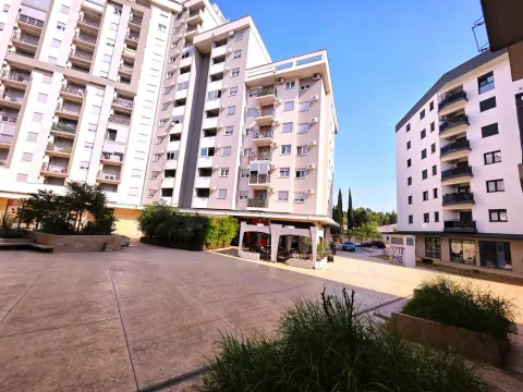 Exterior view of the residential building with a paved courtyard. - image 10