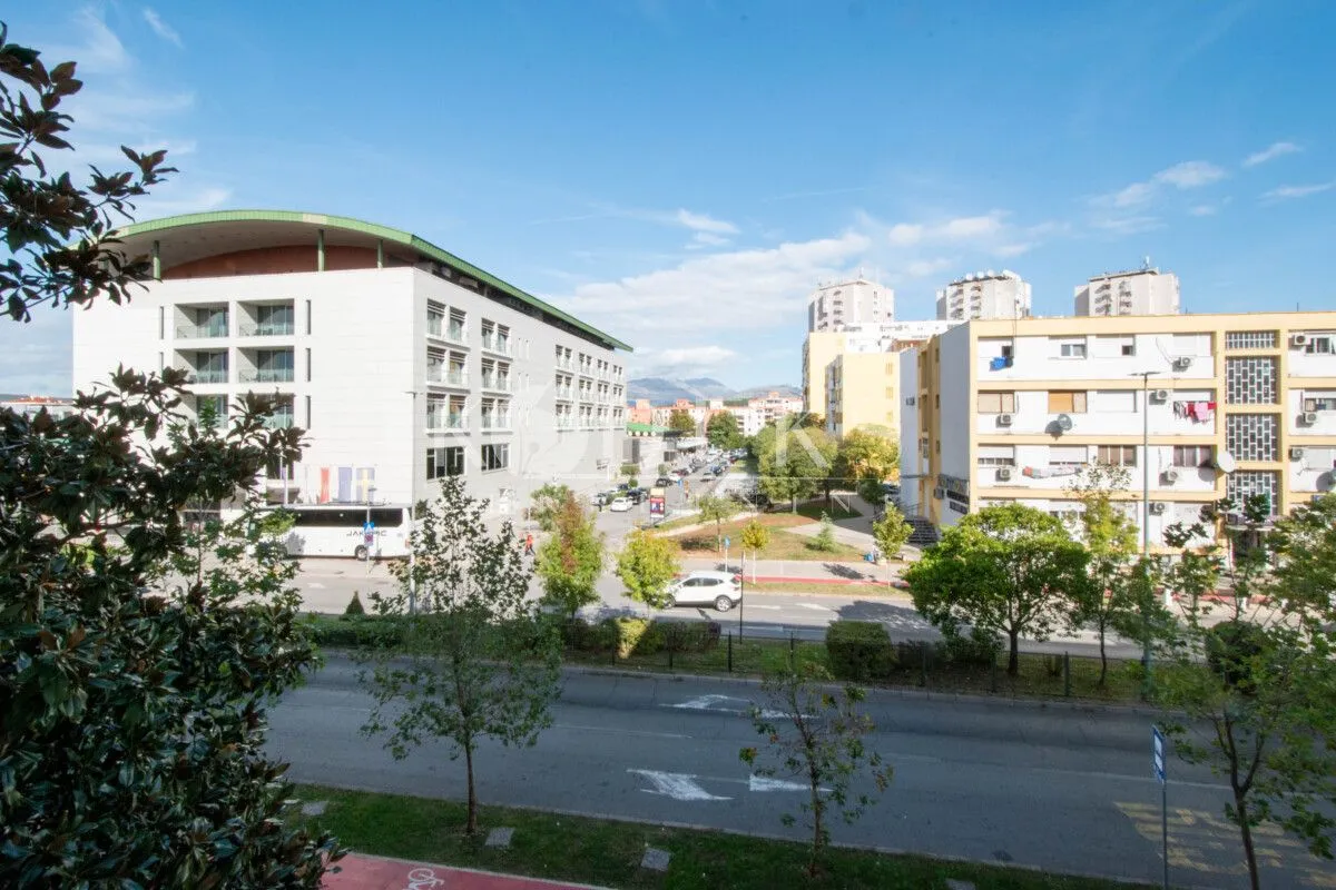 View from the window overlooking the street and surrounding buildings.