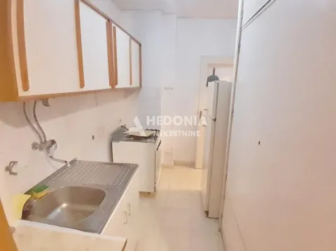 Small kitchen with a sink, cabinetry, and kitchen appliances. - image 5