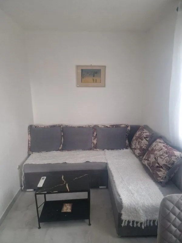 Living room with a corner sofa and a coffee table.