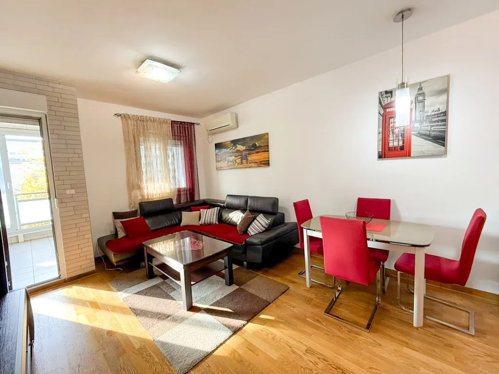 Living room with sofa set and dining area.