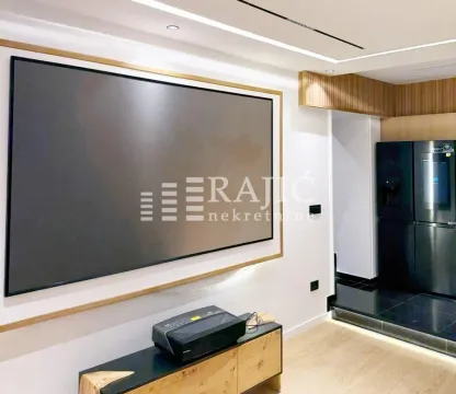 Modern living room with a large projector screen and recessed lighting. - image 3