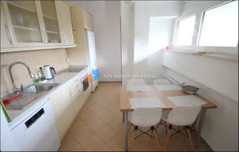 Kitchen with a dining table and chairs by the window. - image 14