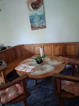 Wooden dining table with a bench and chairs. - image 5