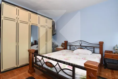 Bedroom with a large double bed and a fitted wardrobe. - image 7