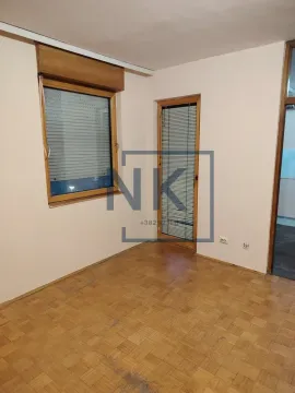 Empty room with wooden parquet flooring and a window with blinds. - image 7