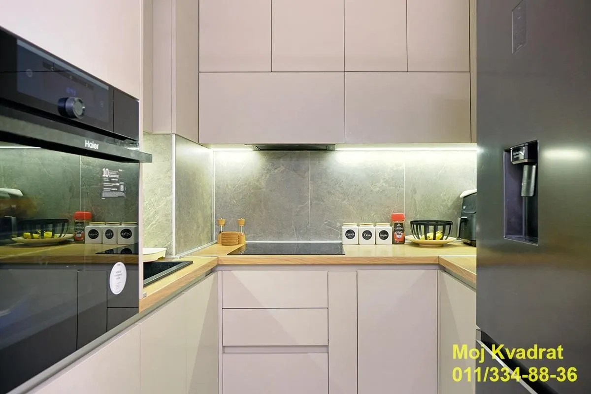 Modern kitchen with built-in cabinetry and appliances.