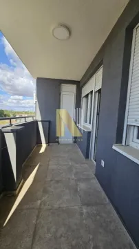 Long tiled balcony with a railing and a view of the surroundings. - image 14